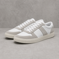 White trainers on a concrete surface